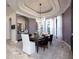 Elegant dining room with sophisticated lighting and ample seating for formal gatherings at 17221 Breeders Cup Dr, Odessa, FL 33556