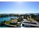 Waterfront aerial view featuring the Gulf, with a glimpse of cityscape and houses with solar panels at 1860 N Fort Harrison Ave # 301, Clearwater, FL 33755