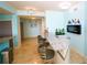 Stylish bar area with granite countertops, bar stool seating, and a built-in fireplace at 1860 N Fort Harrison Ave # 301, Clearwater, FL 33755