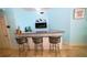 Stylish bar area featuring granite countertops, bar stool seating, and a built-in fireplace at 1860 N Fort Harrison Ave # 301, Clearwater, FL 33755