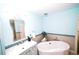 Elegant bathroom featuring a soaking tub, stylish vanity, and modern fixtures with sleek mirror at 1860 N Fort Harrison Ave # 301, Clearwater, FL 33755