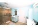 Bright bathroom featuring a glass-enclosed shower, vanity, and stylish accents at 1860 N Fort Harrison Ave # 301, Clearwater, FL 33755