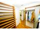 Large walk-in closet with custom shelves and access to the bathroom at 1860 N Fort Harrison Ave # 301, Clearwater, FL 33755