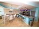 Bright dining area with modern furnishings, an island with bar stool seating, and a chandelier at 1860 N Fort Harrison Ave # 301, Clearwater, FL 33755