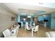 Modern dining area open to living spaces and kitchen featuring stylish furnishings and contemporary design at 1860 N Fort Harrison Ave # 301, Clearwater, FL 33755
