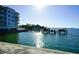 Waterfront view of condominium, with boats docked and glistening water adding a touch of luxury at 1860 N Fort Harrison Ave # 301, Clearwater, FL 33755