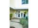 Inviting condo entrance with a combination of doors, and decorative plants, creating a warm and welcoming arrival at 1860 N Fort Harrison Ave # 301, Clearwater, FL 33755