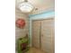 Elegant entryway featuring unique decor, stylish lighting, and modern closet doors at 1860 N Fort Harrison Ave # 301, Clearwater, FL 33755
