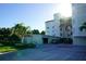 Exterior view of parking garage and entrance to condominium building with sun glare enhancing the architectural details at 1860 N Fort Harrison Ave # 301, Clearwater, FL 33755