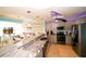 Modern kitchen with stainless steel appliances, granite countertops, and open design concept at 1860 N Fort Harrison Ave # 301, Clearwater, FL 33755