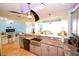 Open concept kitchen with granite countertops and stainless steel appliances at 1860 N Fort Harrison Ave # 301, Clearwater, FL 33755