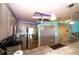 Bright, modern kitchen with stainless steel appliances and stylish hanging pendant lighting at 1860 N Fort Harrison Ave # 301, Clearwater, FL 33755