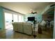 Bright, open living room with large windows and modern decor with adjoining kitchen and dining areas at 1860 N Fort Harrison Ave # 301, Clearwater, FL 33755