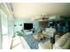 Bright, open living room with large windows and modern decor with adjoining kitchen and dining areas at 1860 N Fort Harrison Ave # 301, Clearwater, FL 33755