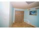 Light and airy room with a neutral palette and modern closet doors, ready for customization at 1860 N Fort Harrison Ave # 301, Clearwater, FL 33755