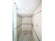 Modern shower with a glass enclosure, mosaic tile floor, and updated fixtures at 1860 N Fort Harrison Ave # 301, Clearwater, FL 33755