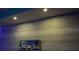 Contemporary wood-look wall with recessed lighting and decorative art at 1860 N Fort Harrison Ave # 301, Clearwater, FL 33755
