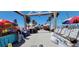 Outdoor marketplace with colorful umbrellas, vendor booths, and shoppers on a sunny day at 2047 Indigo Dr, Clearwater, FL 33763