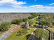 Beautiful aerial view of community entrance, showcasing the well-manicured landscaping and scenic surroundings at 22229 Storybook Cabin Way, Land O Lakes, FL 34637