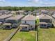 Overhead view of backyards with covered patios and privacy fences at 22229 Storybook Cabin Way, Land O Lakes, FL 34637