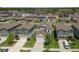 An aerial view of several homes in the neighborhood at 22229 Storybook Cabin Way, Land O Lakes, FL 34637