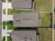 Top down aerial view of the roof, yard, and driveway of a house at 22229 Storybook Cabin Way, Land O Lakes, FL 34637