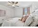 A bright bedroom featuring lovely wall details, plush carpet, white furniture and lots of natural light at 22229 Storybook Cabin Way, Land O Lakes, FL 34637