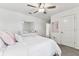 A bright bedroom featuring lovely wall details, plush carpet, white furniture and lots of natural light at 22229 Storybook Cabin Way, Land O Lakes, FL 34637