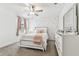 A bright bedroom featuring lovely wall details, plush carpet, white furniture and lots of natural light at 22229 Storybook Cabin Way, Land O Lakes, FL 34637