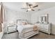 A bright bedroom featuring lovely wall details, plush carpet, white furniture and lots of natural light at 22229 Storybook Cabin Way, Land O Lakes, FL 34637