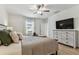 Spacious bedroom with natural light and ceiling fan offers comfort with updated decor and furnishings at 22229 Storybook Cabin Way, Land O Lakes, FL 34637