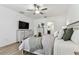 Inviting bedroom with a ceiling fan provides relaxation with neutral decor and updated furnishings throughout at 22229 Storybook Cabin Way, Land O Lakes, FL 34637