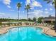 Relaxing community pool area with ample seating and a serene atmosphere at 22229 Storybook Cabin Way, Land O Lakes, FL 34637