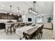 Open-concept dining area, kitchen with island seating, and a comfortable living room at 22229 Storybook Cabin Way, Land O Lakes, FL 34637