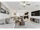 Comfortable living room that opens to the kitchen and features modern decor and an open-concept design at 22229 Storybook Cabin Way, Land O Lakes, FL 34637