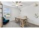 Bright office space featuring a desk, comfortable seating, and a large window for natural light and a modern touch at 22229 Storybook Cabin Way, Land O Lakes, FL 34637