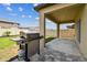 Covered patio with a barbecue grill and a view of the backyard at 22229 Storybook Cabin Way, Land O Lakes, FL 34637