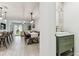 View of living room, dining area, and stylish powder room with modern vanity at 22229 Storybook Cabin Way, Land O Lakes, FL 34637