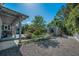 Private backyard featuring a shed, and beautiful mature trees at 223 Lime S Cir, Dunedin, FL 34698