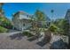 Spacious backyard with seating area, patio and lush greenery, perfect for outdoor entertaining at 223 Lime S Cir, Dunedin, FL 34698