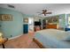 Spacious bedroom with wall-mounted TV and en-suite bathroom at 223 Lime S Cir, Dunedin, FL 34698