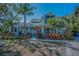 Charming home with mature landscaping and inviting front porch at 223 Lime S Cir, Dunedin, FL 34698