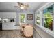 Bright breakfast nook with lots of natural light and views, featuring tile floor and white cabinets at 223 Lime S Cir, Dunedin, FL 34698
