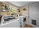 Convenient laundry room with modern washer and dryer at 223 Lime S Cir, Dunedin, FL 34698