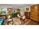 Charming living room featuring hardwood floors, vintage furniture, and eclectic decor at 223 Lime S Cir, Dunedin, FL 34698
