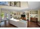 Bright living room with hardwood floors, comfortable sofa, and a view of the outdoors at 223 Lime S Cir, Dunedin, FL 34698