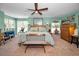 Spacious main bedroom with ample windows and a cozy seating area at 223 Lime S Cir, Dunedin, FL 34698