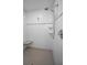Modern tiled shower with rainfall showerhead and built-in seat at 223 Lime S Cir, Dunedin, FL 34698