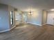 Bright, open-concept living area with modern flooring and neutral paint, ready for personal touches at 2571 Cyprus Dr # 1-102, Palm Harbor, FL 34684