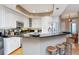 Spacious kitchen with granite countertops, breakfast bar, white cabinets, and stainless appliances at 2837 Bayshore Trails Dr, Tampa, FL 33611
